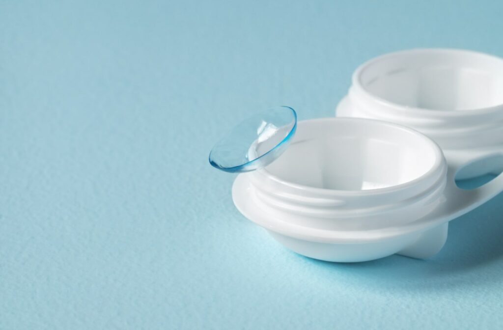 A contact lens sitting on an open contact lens case